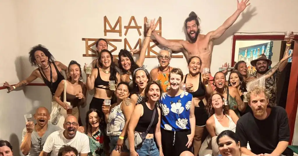 a group of people posing for a picture together at Mambembe Hostel in Rio de Janeiro