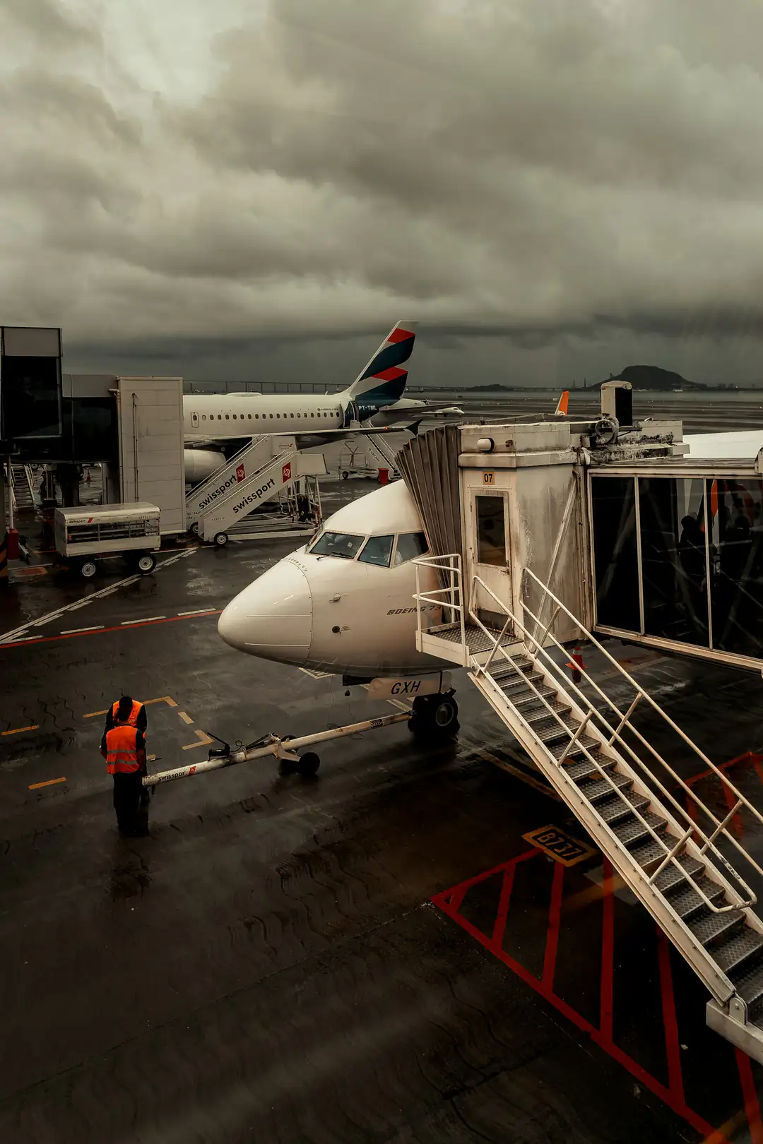 An aircraft parked at a gate at Santos Dumont Airport