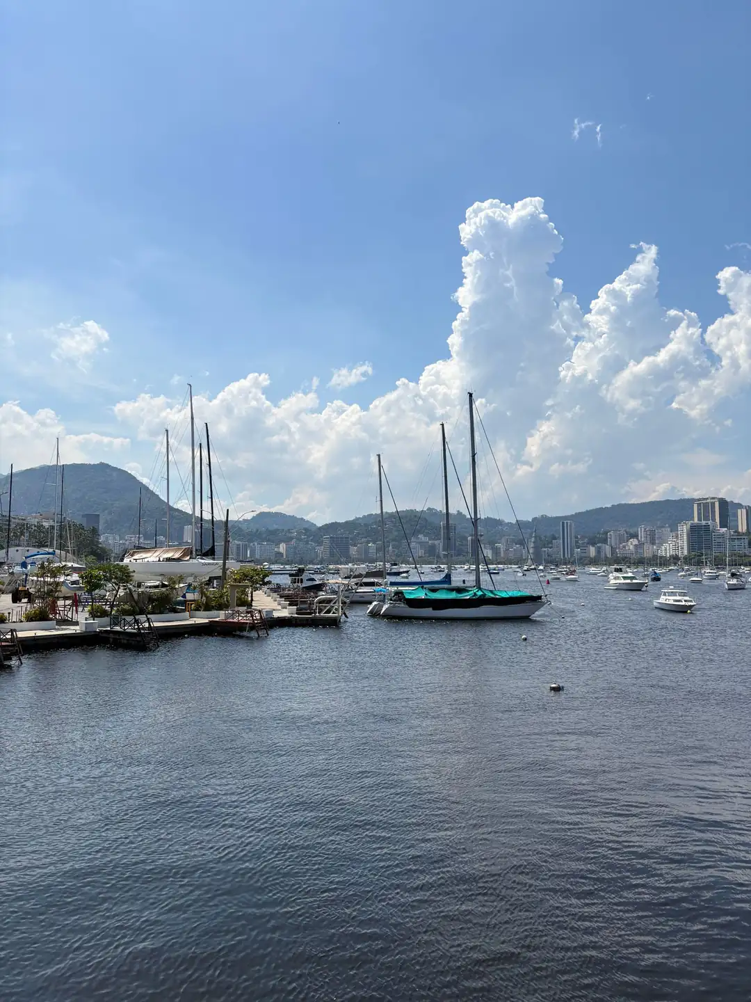 Sailing boats across Guanabara Bay beneath Rio de Janeiro's mountains