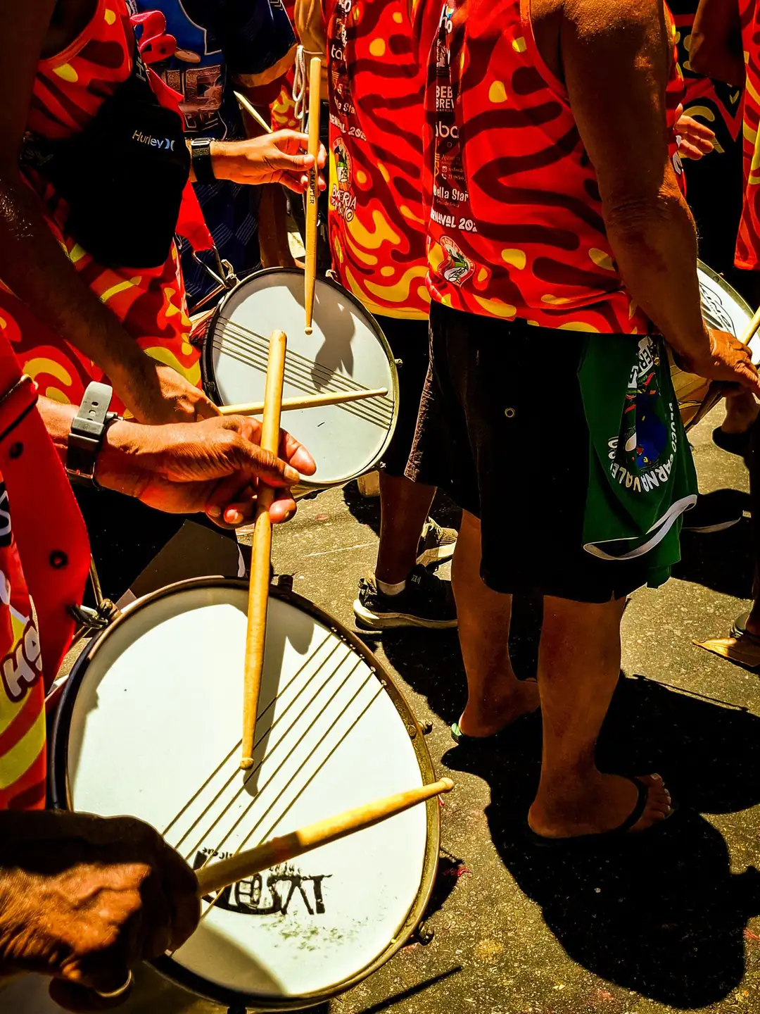 Street Carnival drummers performing in colourful costumes in Rio de Janeiro