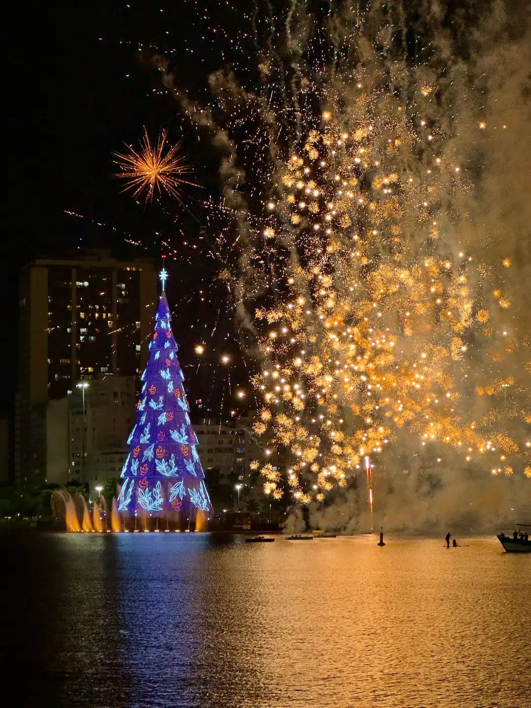 Fireworks above the illuminated Christmas tree at Lagoa Rodrigo de Freitas in Rio de Janeiro