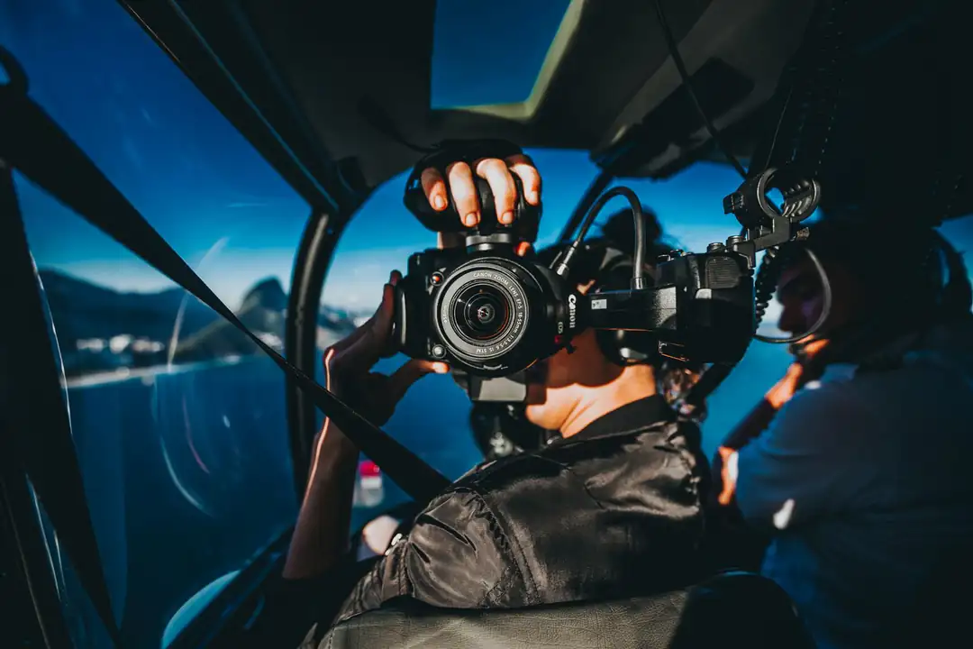 Passenger photographing Rio de Janeiro from inside a helicopter