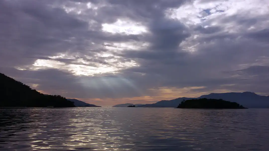 Sunrise over the water during the boat crossing to Ilha Grande