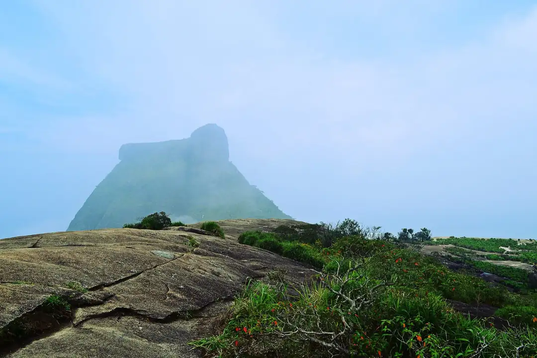 Granite summit of Pedra Bonita with clouds around Pedra da Gávea
