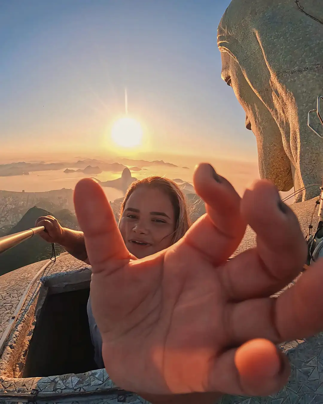 A solo traveller taking a photo at Christ the Redeemer