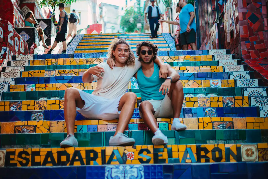 Visitors sitting on the colourful Selarón Steps in Rio de Janeiro