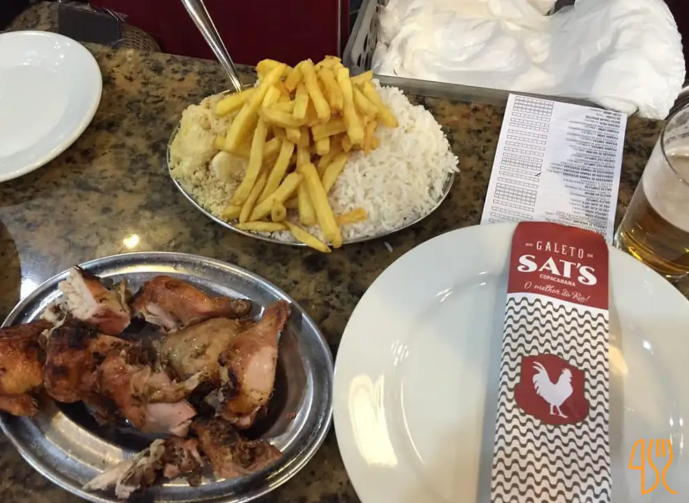 Galeto and side dishes served at Galeto Sat's in Copacabana