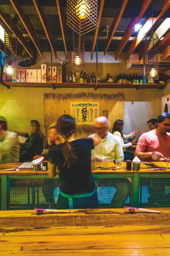 The counter and dining room at Pabu Izakaya in Leblon