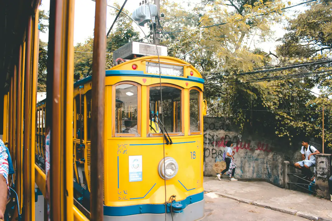 Yellow tram and street life in Santa Teresa, Rio de Janeiro